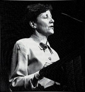 A person standing at a podiumAI-generated content may be incorrect.